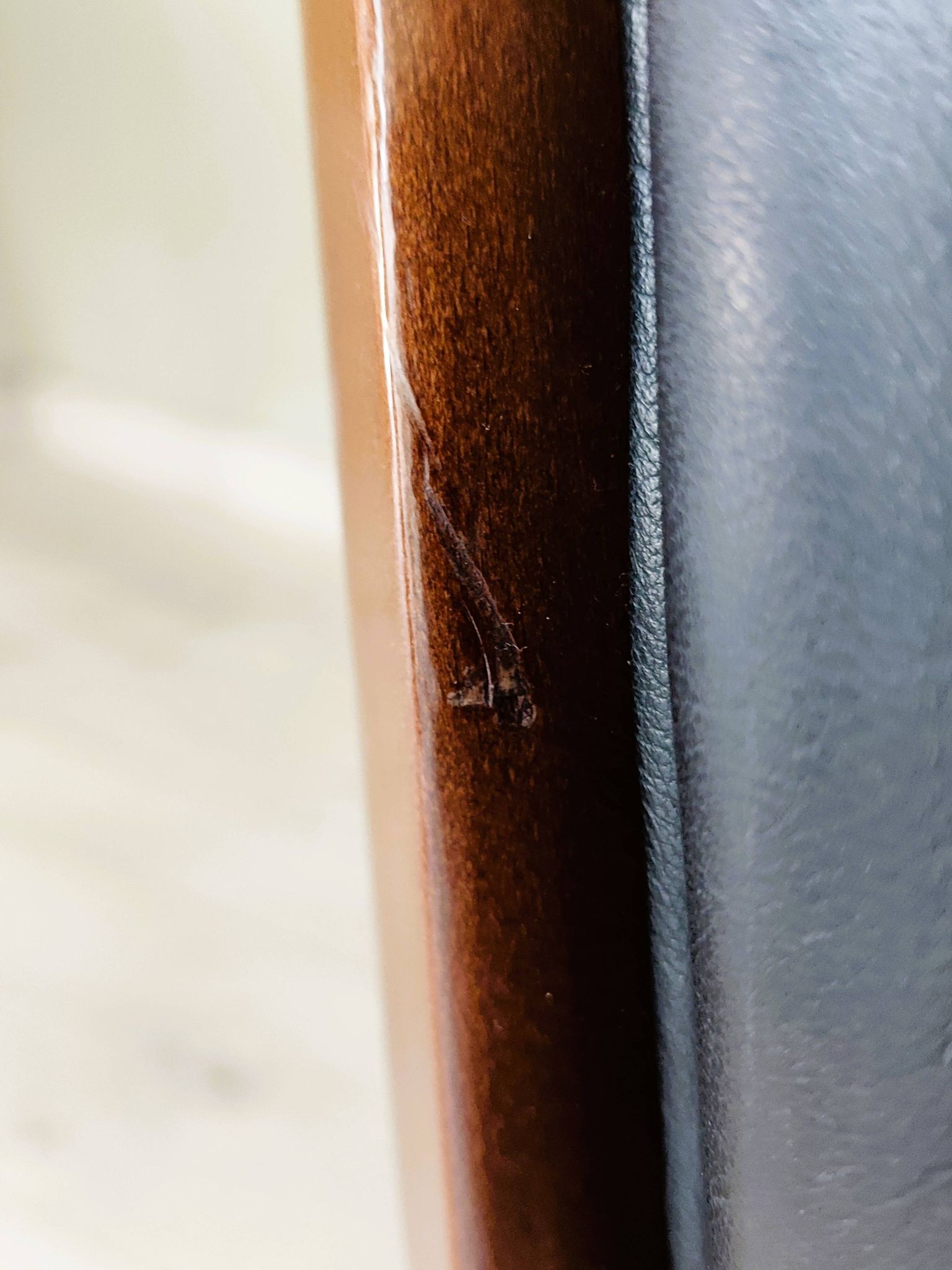 Black leather rocking Chesterfield armchair