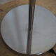 Flexible floor lamp, chrome, opaque white shade with metallic edges.