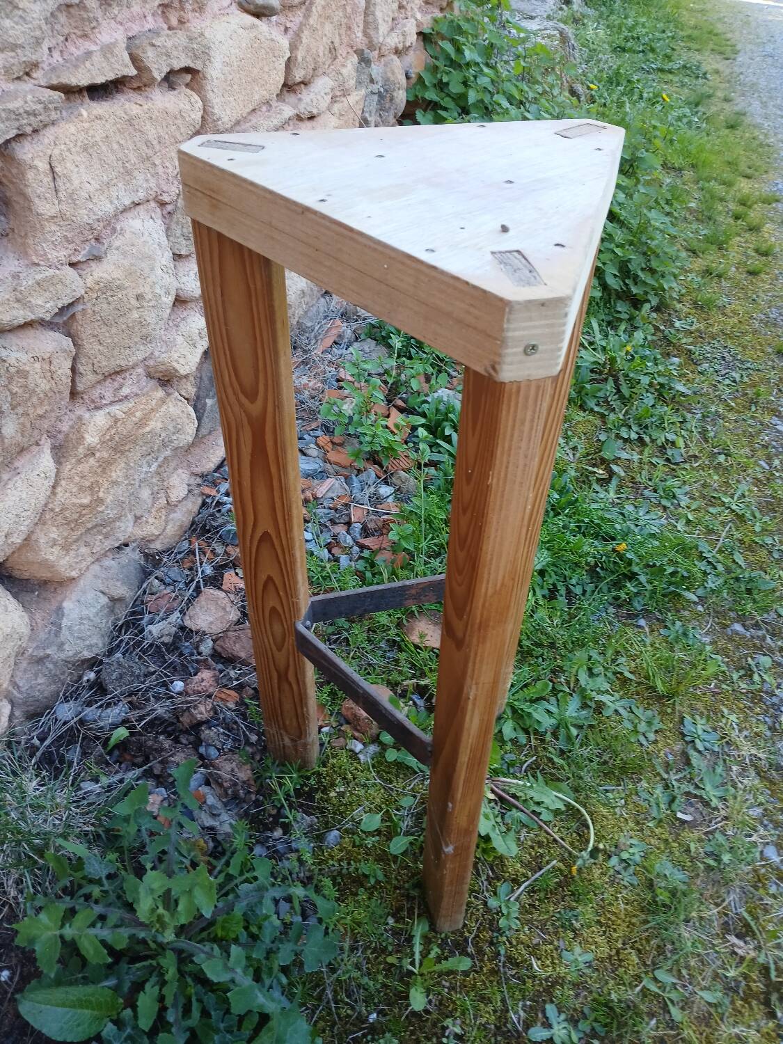 Antique saddle in raw wood and metal