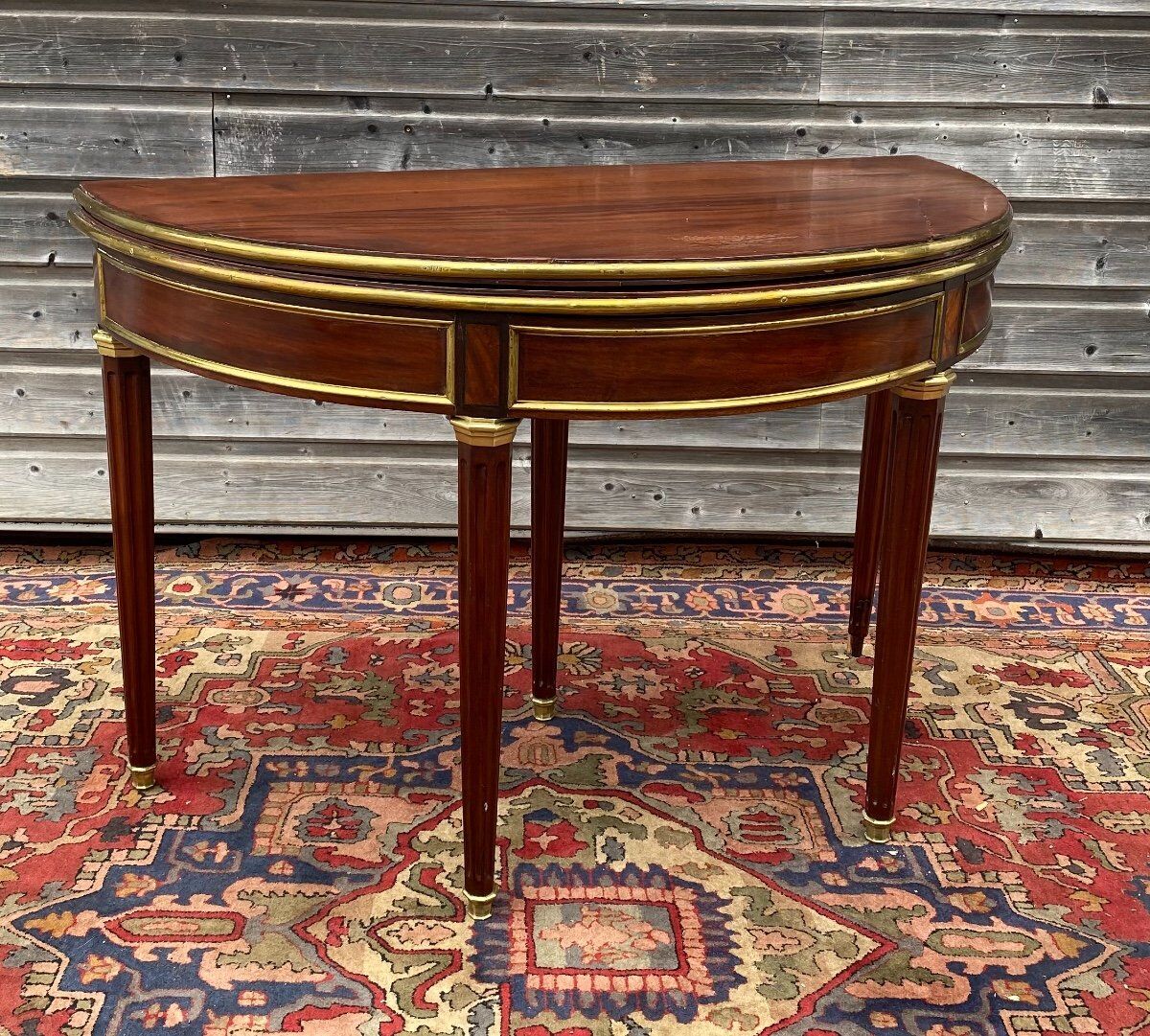 Half moon table in mahogany era Louis XVI XVIII th century