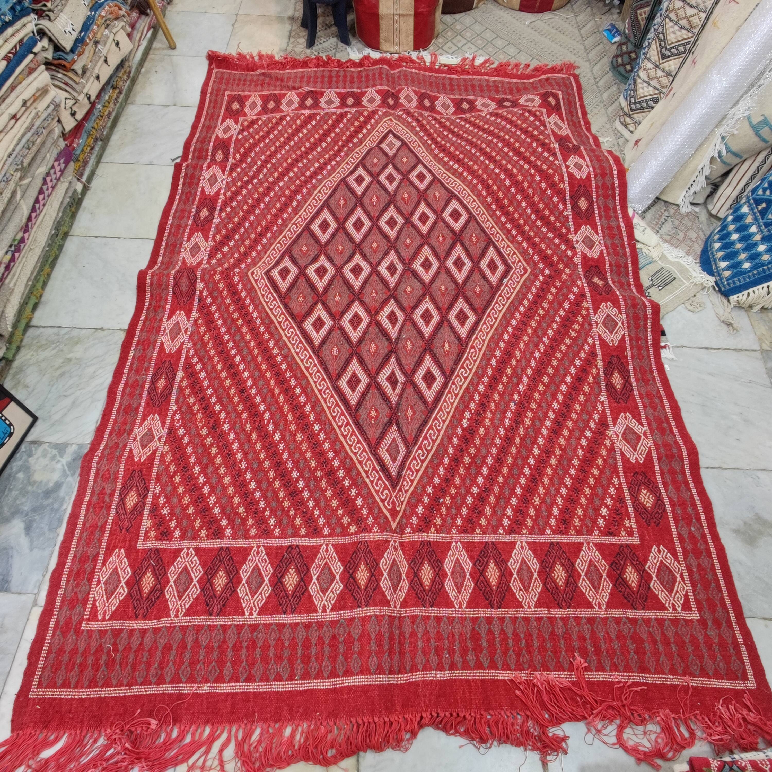 Hand-woven red margoum carpet
