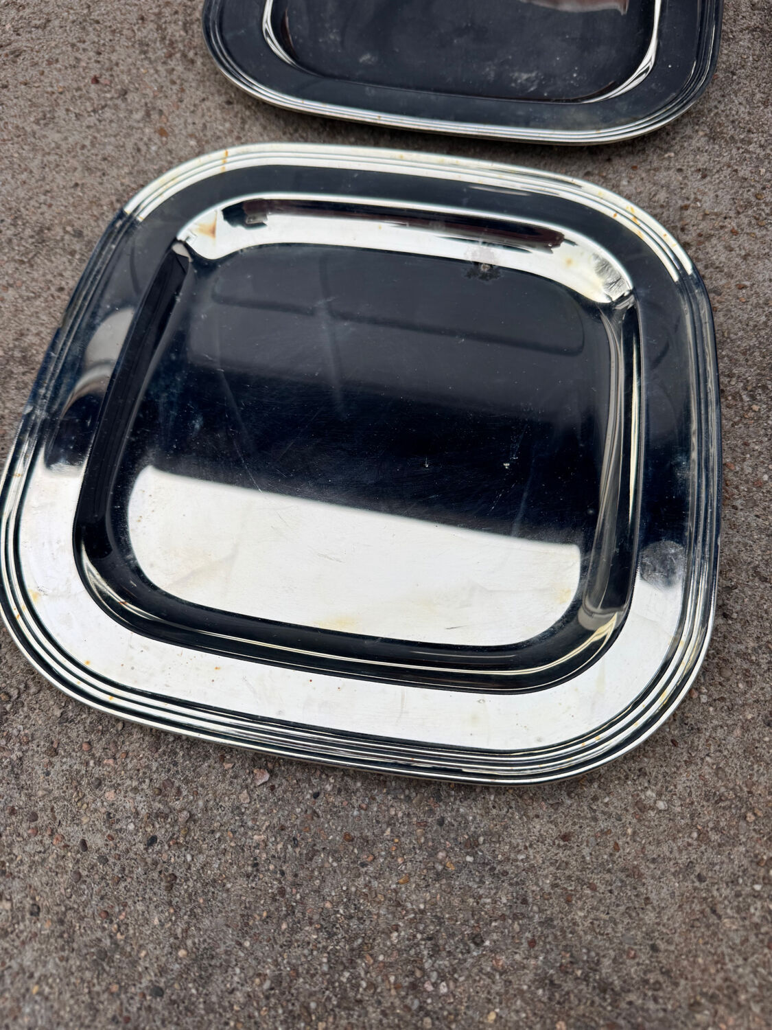 Silver-plated metal underplates from the 1980s.