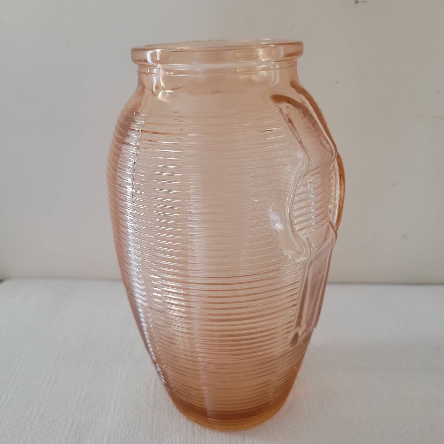 Salmon-colored Art Deco pressed glass vase