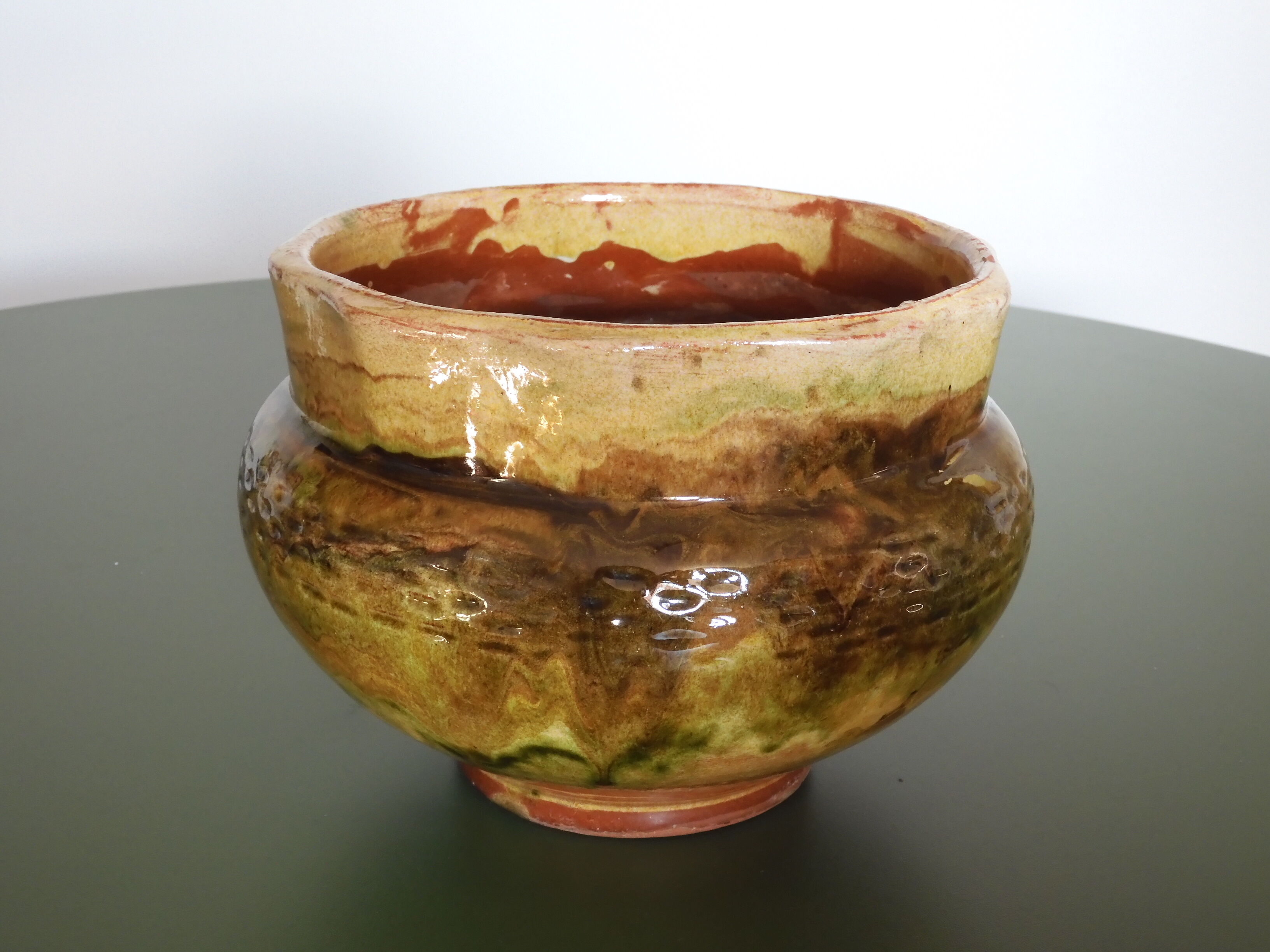 Provencal terracotta pot cover.