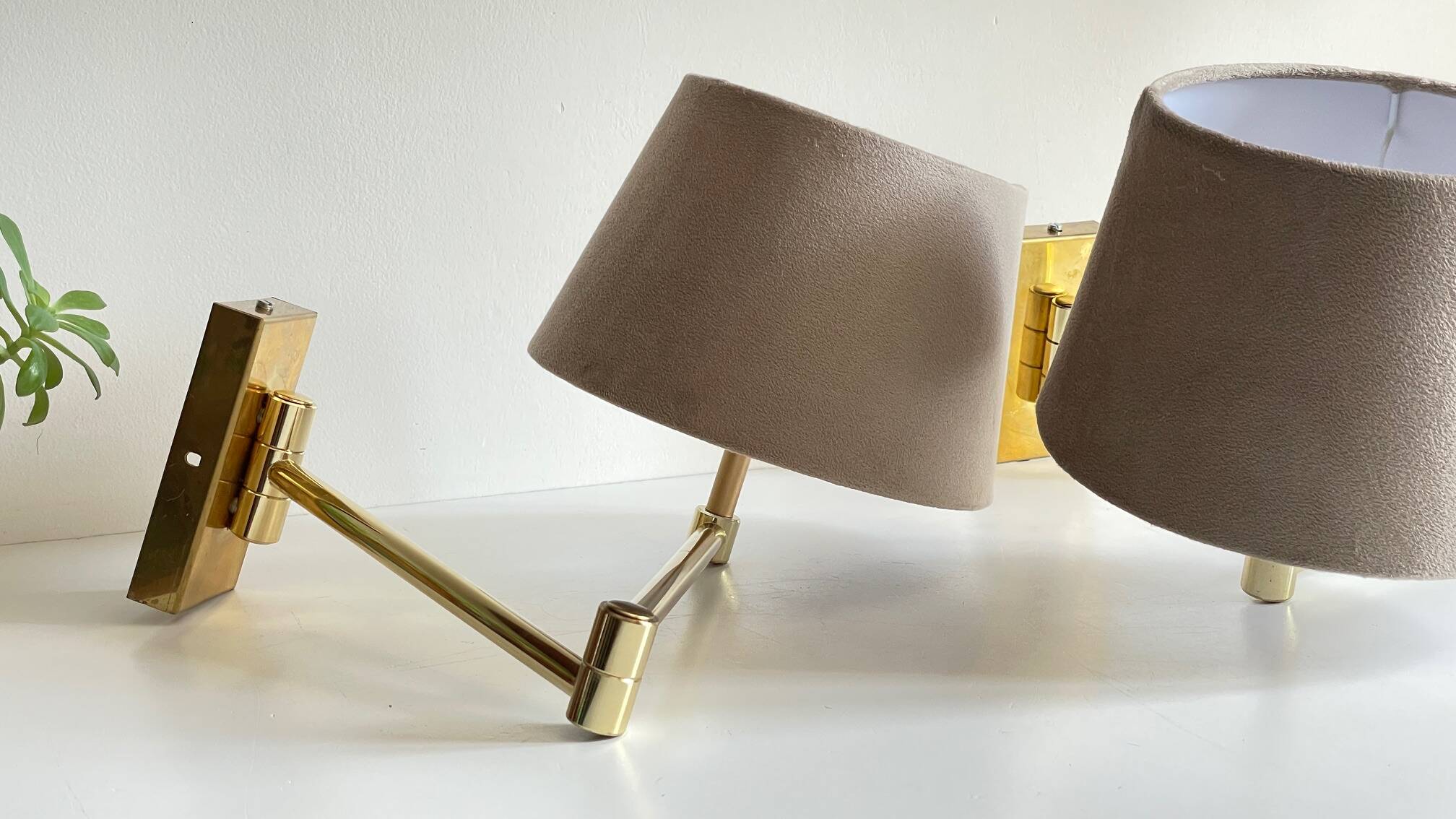 articulated brass and velvet wall light