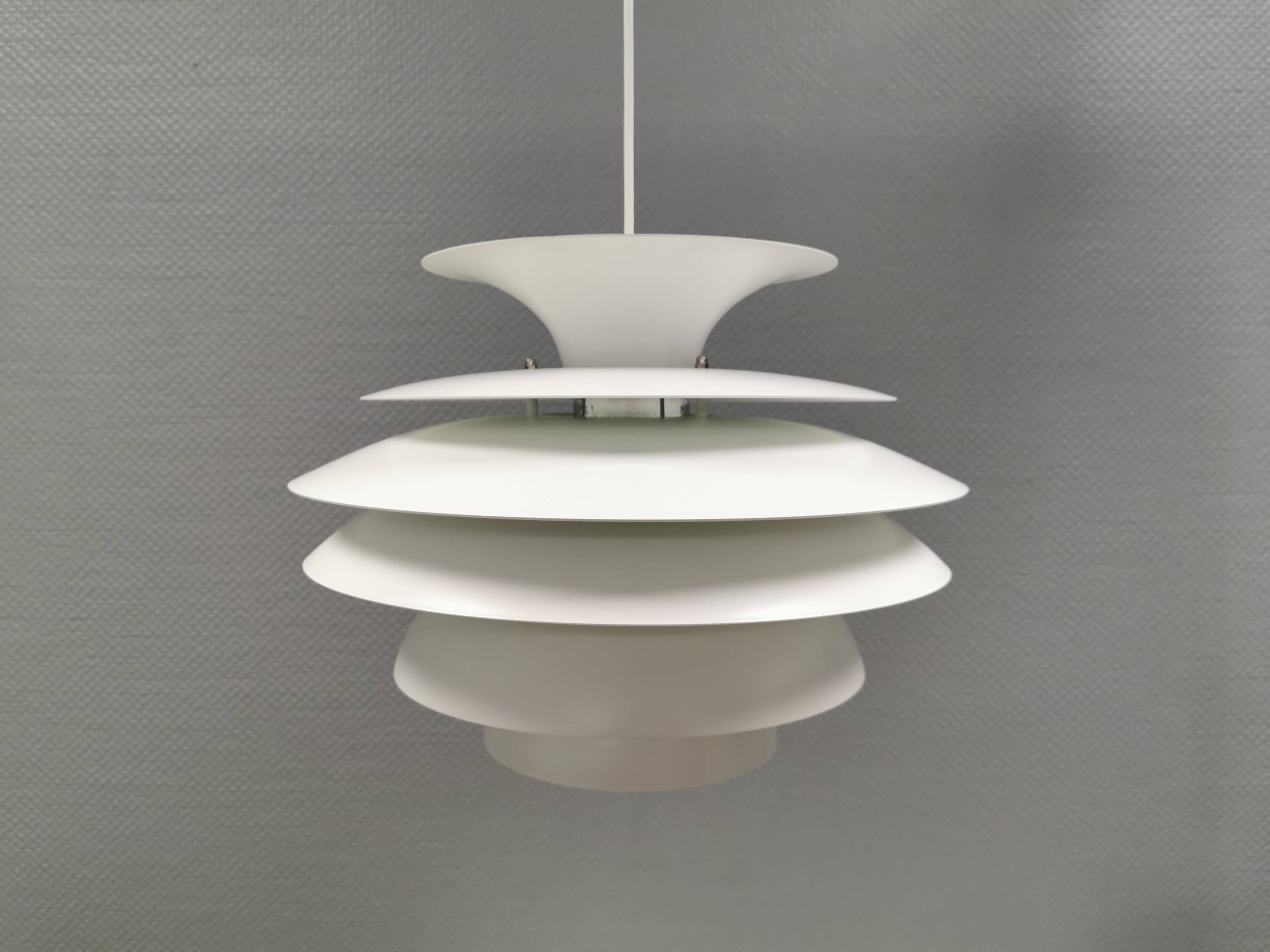 Hanging lamp with multiple layers of shades, by Junge/Vitrika