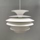 Hanging lamp with multiple layers of shades, by Junge/Vitrika