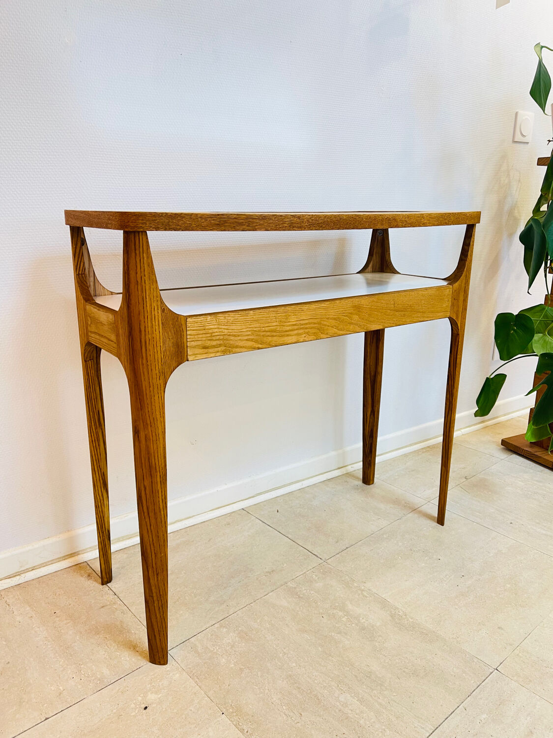 Small contemporary console in stained walnut wood.