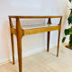 Small contemporary console in stained walnut wood.