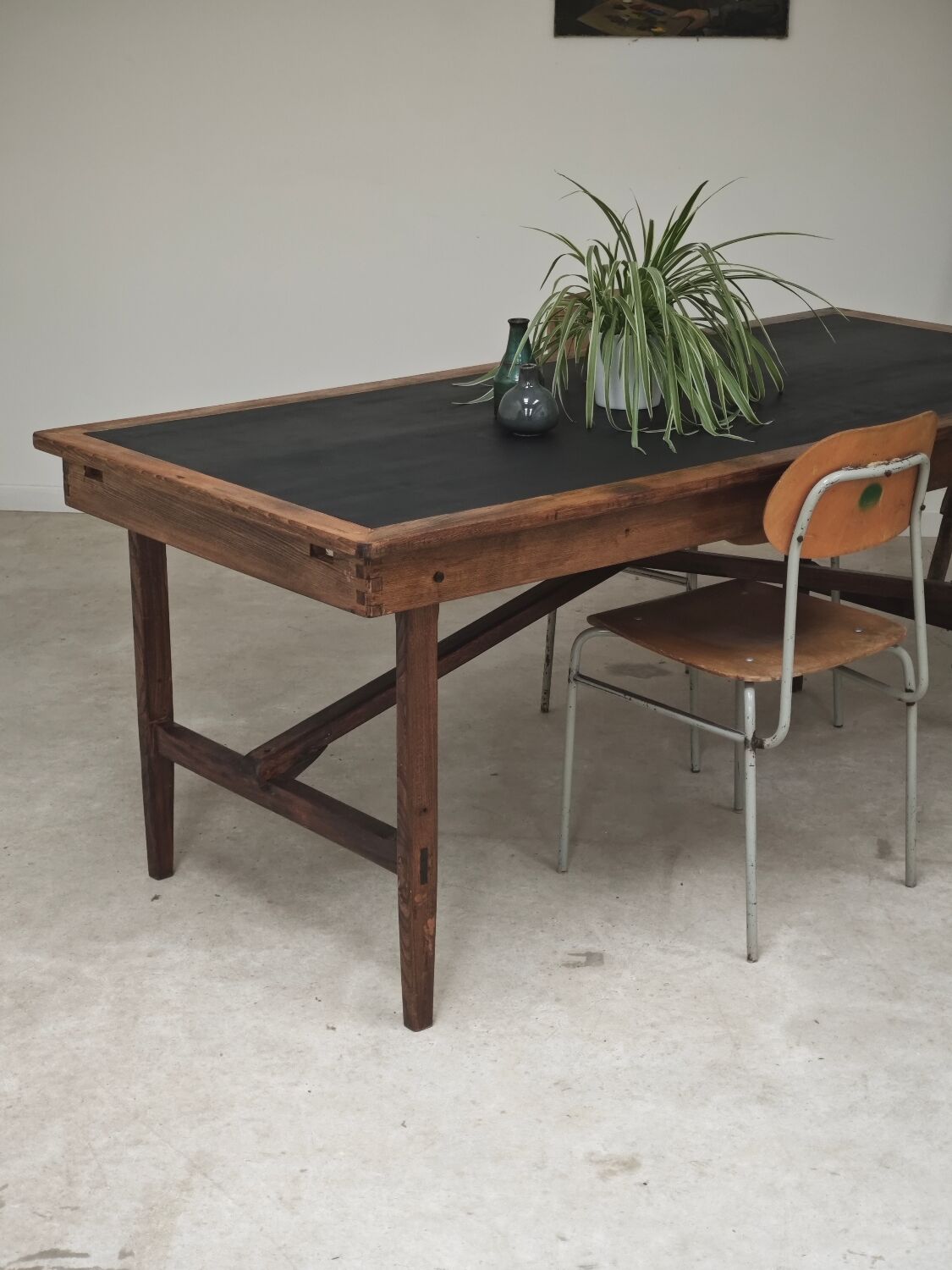 Vintage workshop folding table in oak with a hand-patinated black top.