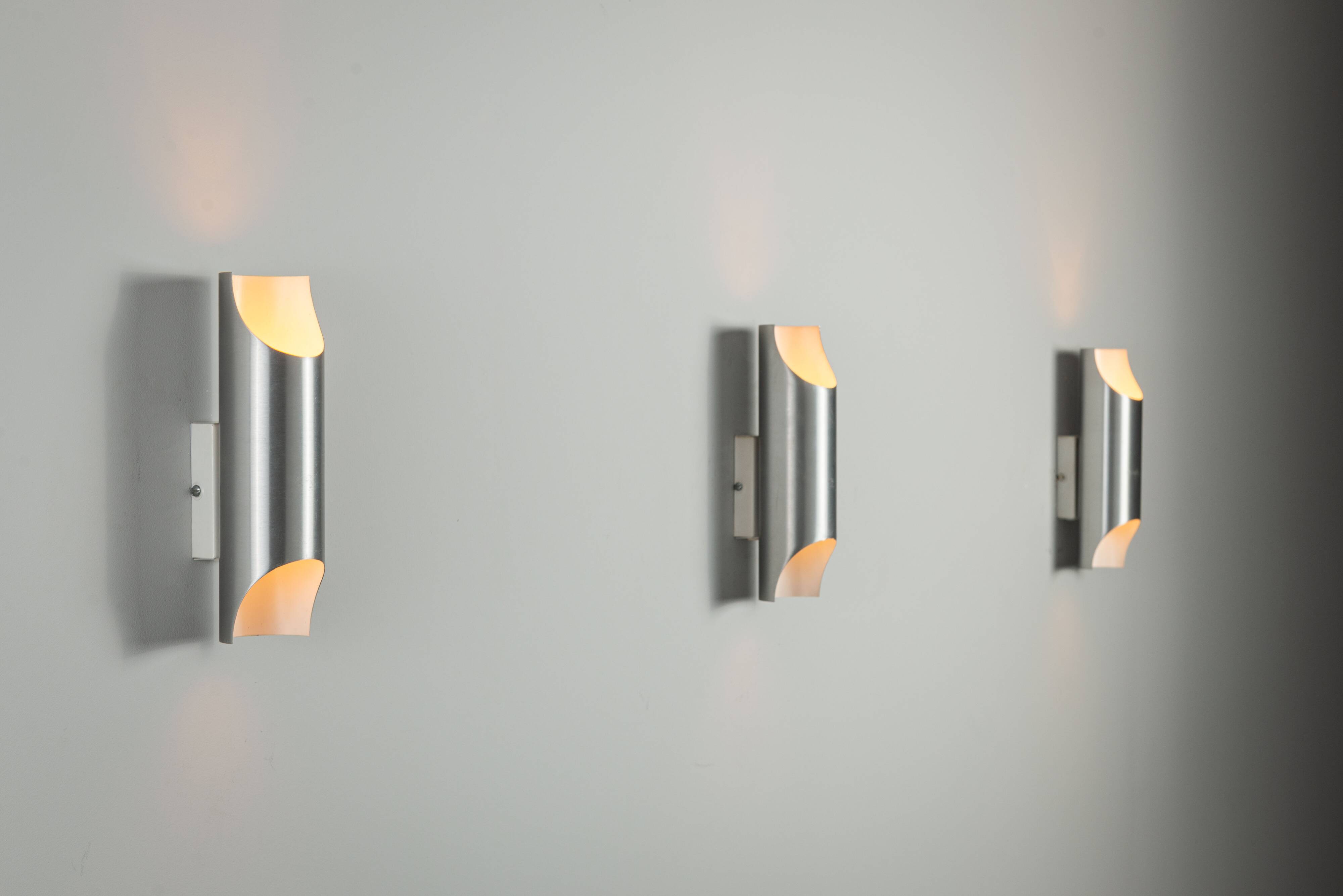 Set of three aluminium cylindrical wall lamps