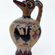 Clay pitcher with a bird head
