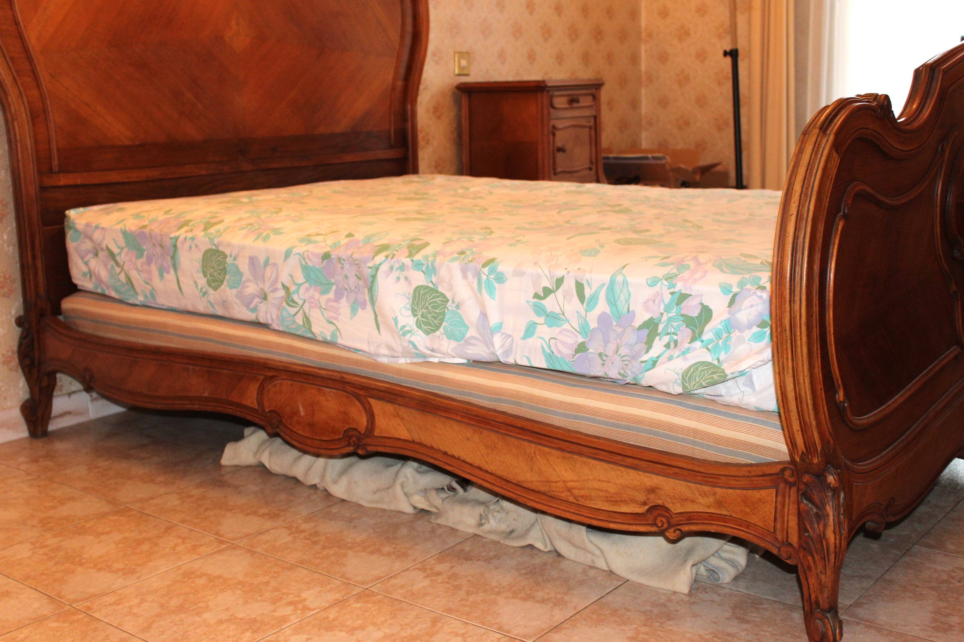 Walnut rocaille bed from the early 20th century.