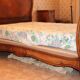 Walnut rocaille bed from the early 20th century.