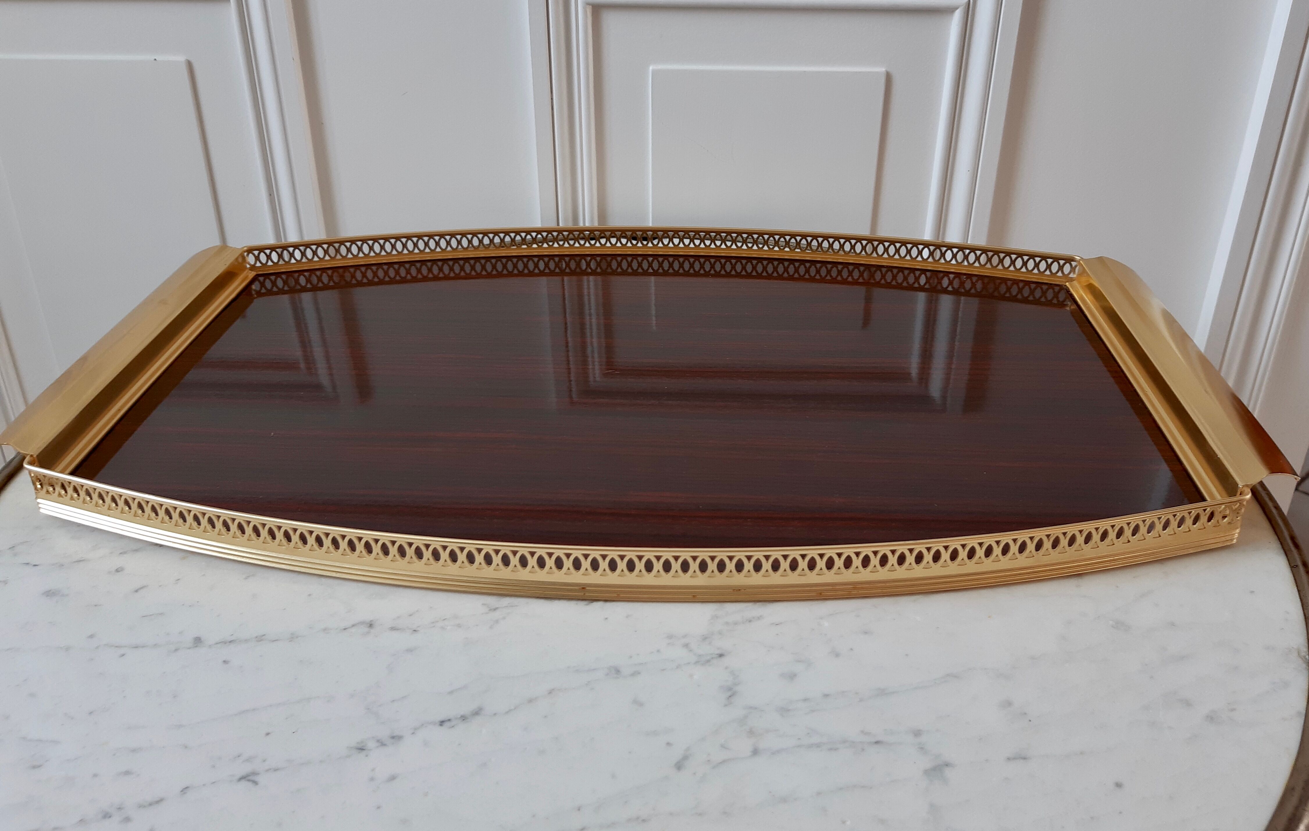 Top in formica and gilded brass 50s