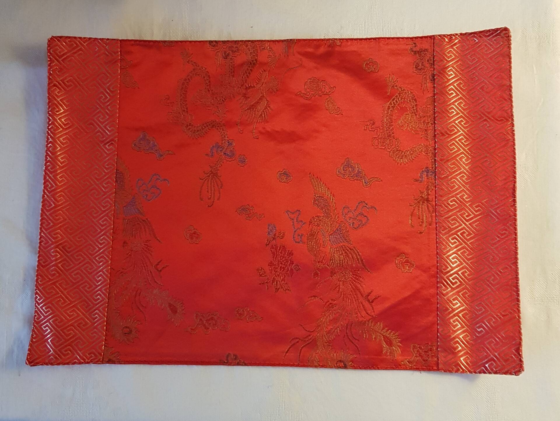 Set of 6 small table napkins in red brocade.