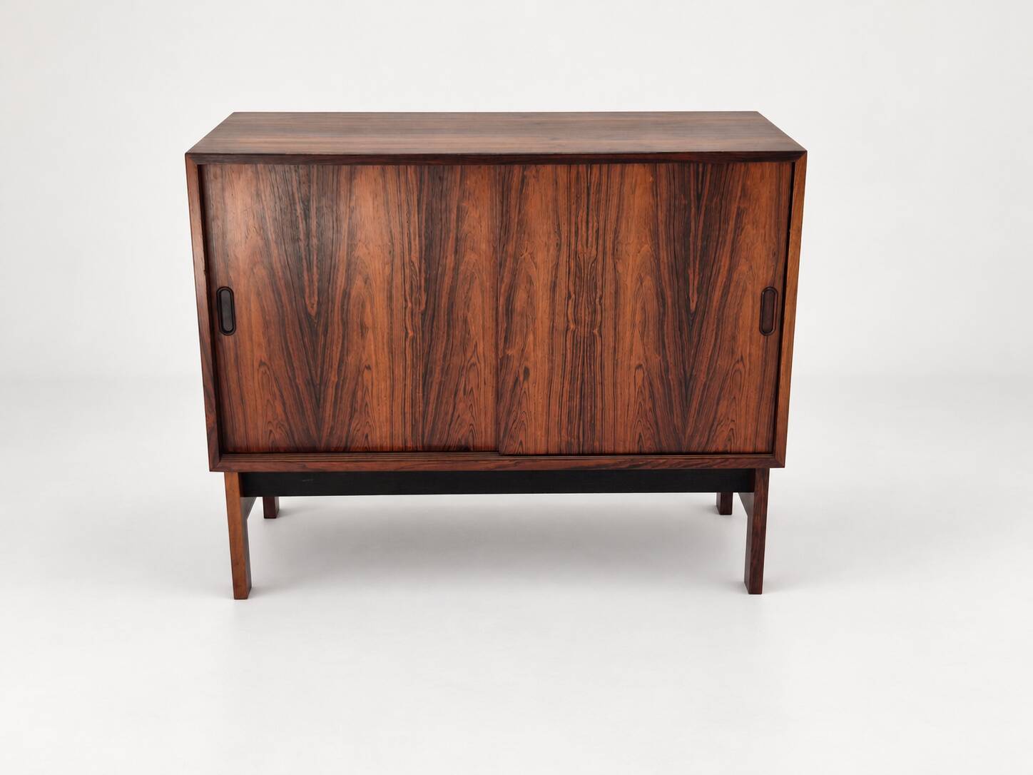 Low sideboard in rosewood with sliding doors. Denmark, 1960s
