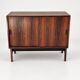 Low sideboard in rosewood with sliding doors. Denmark, 1960s