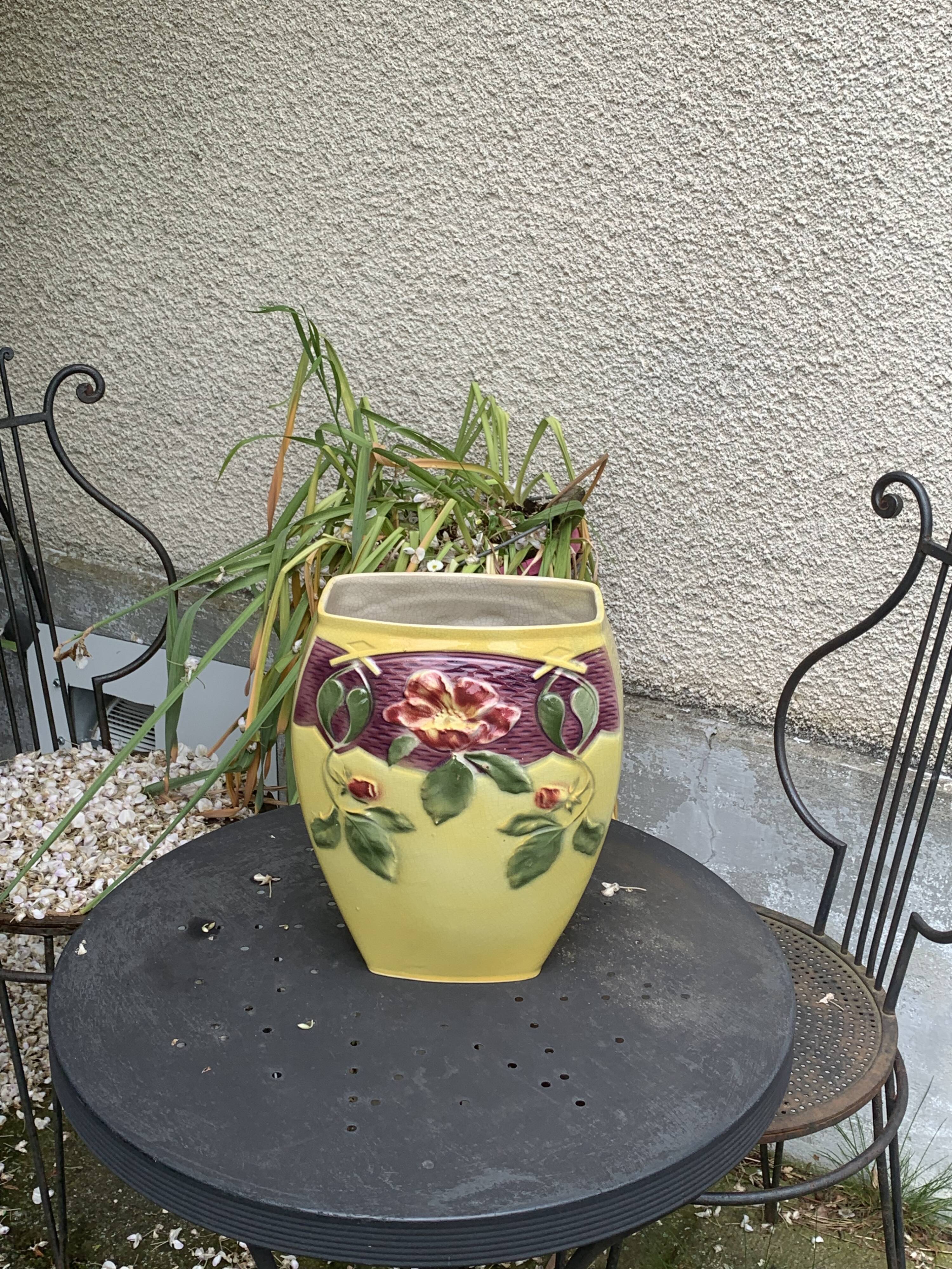 Yellow glazed ceramic slip vase with hawthorn pink flower motif