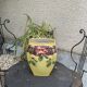 Yellow glazed ceramic slip vase with hawthorn pink flower motif