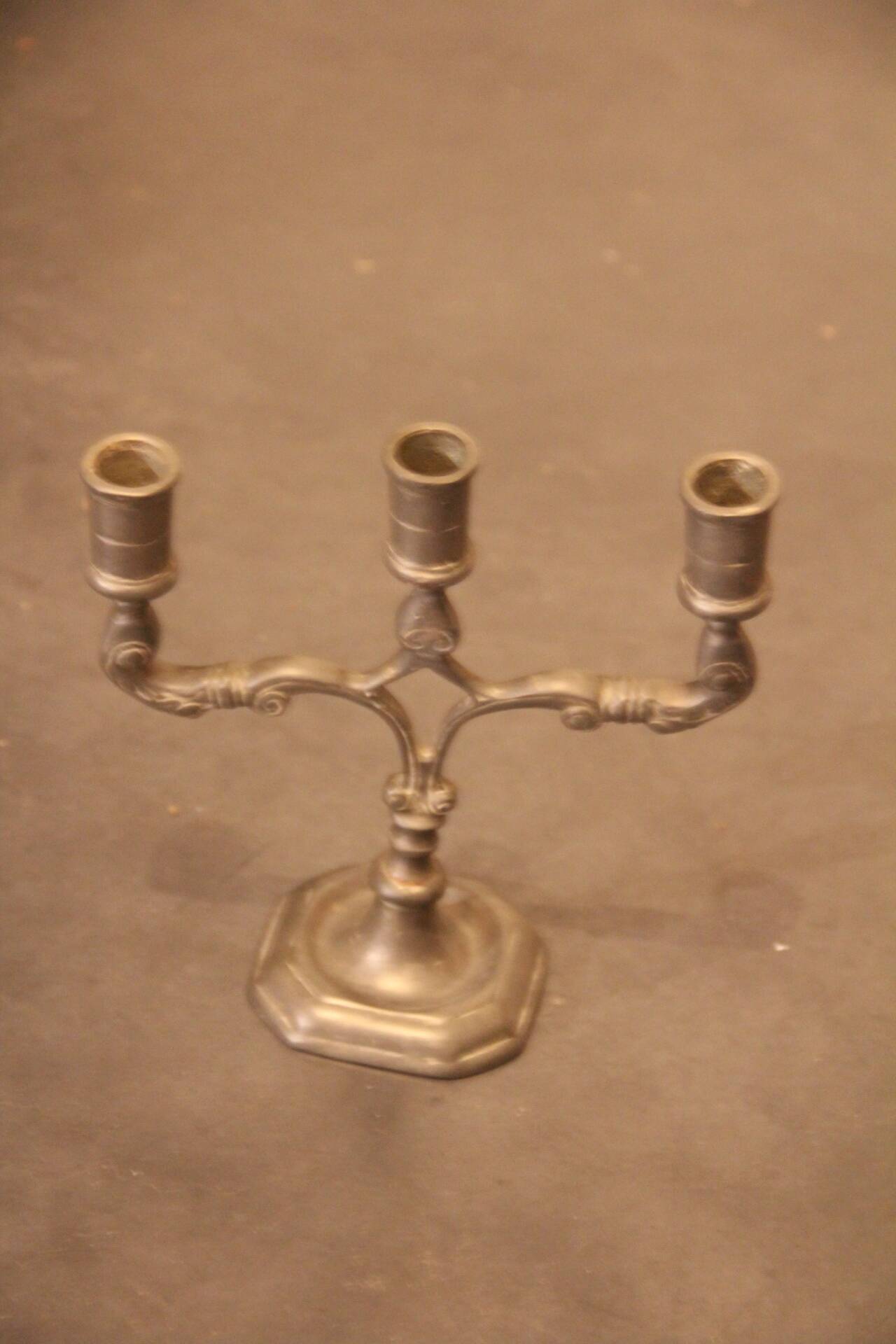 Small three-armed candlestick in pewter.