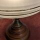 Vintage lamp made of turned wood, brass, and frosted glass.
