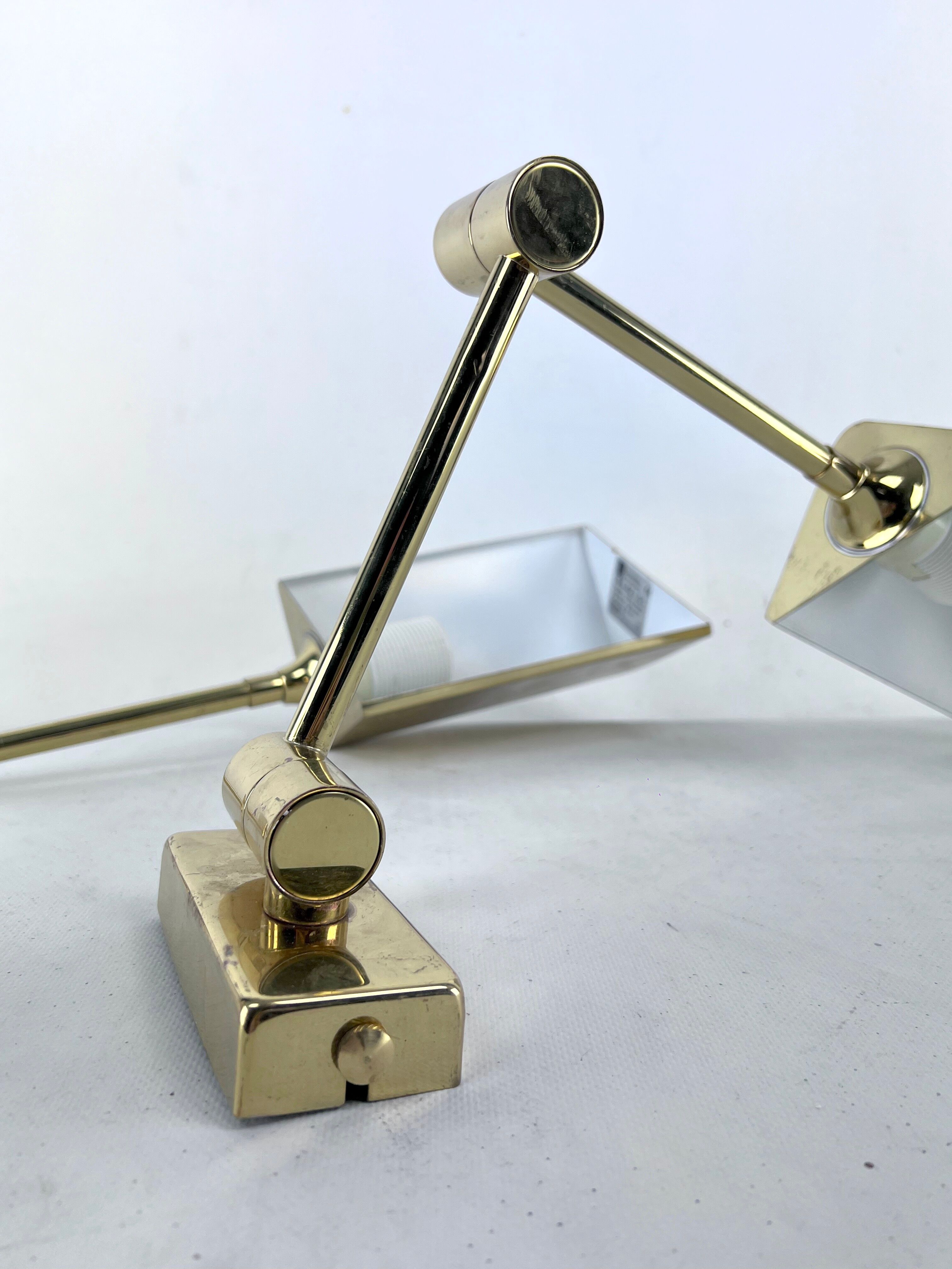 Postmodern pair of articulated brass wall lamps by Baulmann Leuchten. Germany 1980s