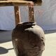 Large traditional Indonesian clay pot featuring a dragon.