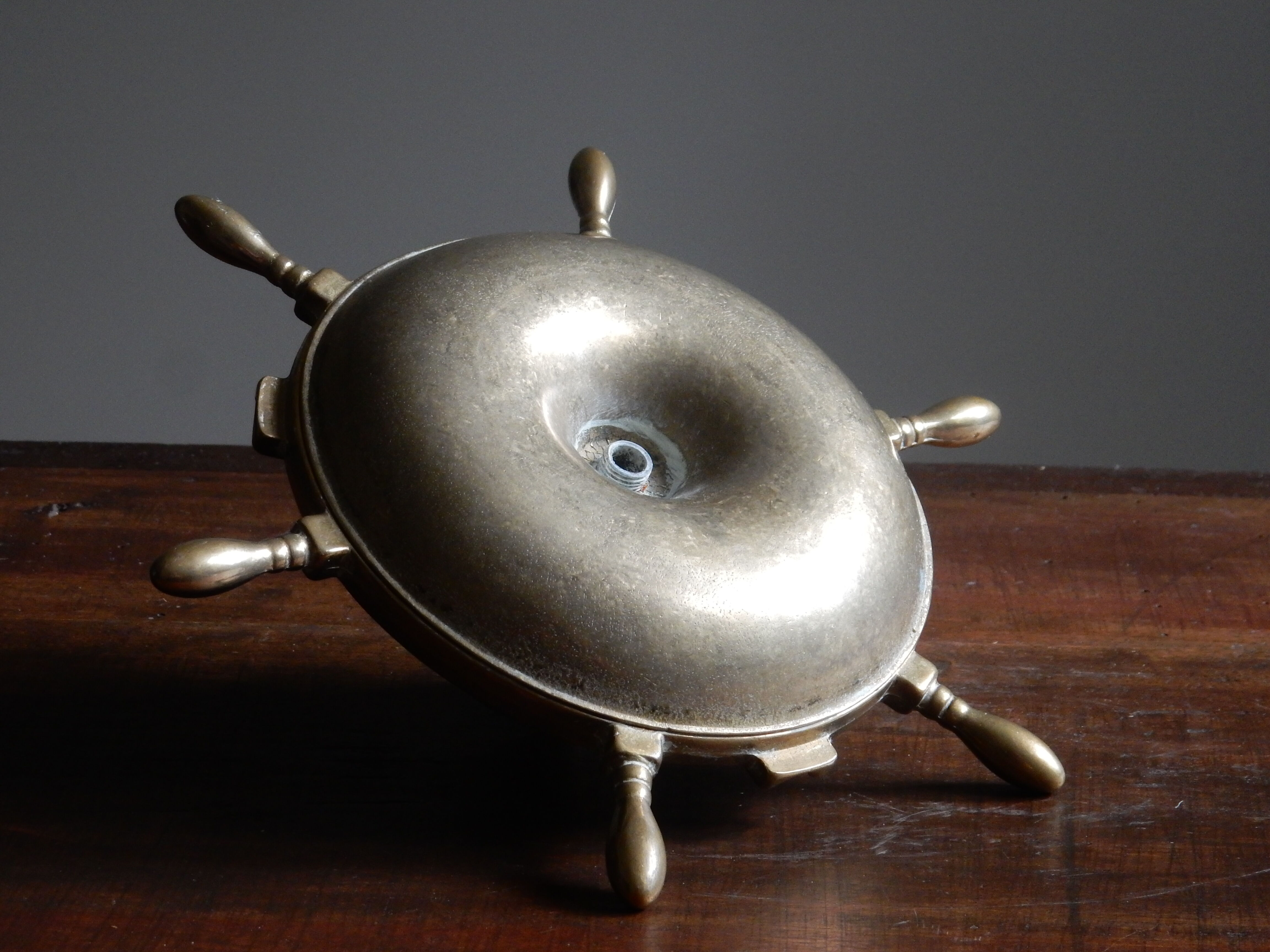 Brass ashtray and candlestick shaped boat bar
