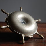 Brass ashtray and candlestick shaped boat bar