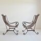 Paire de fauteuils en fer forgé et cuir vintage