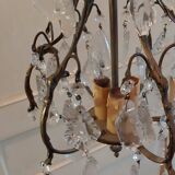 Small bronze "cage" chandelier with three lights decorated with tassels and pendant. Late 19th century
