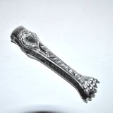 Rocaille sugar tongs in silver metal with lion claw medallion