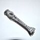 Rocaille sugar tongs in silver metal with lion claw medallion
