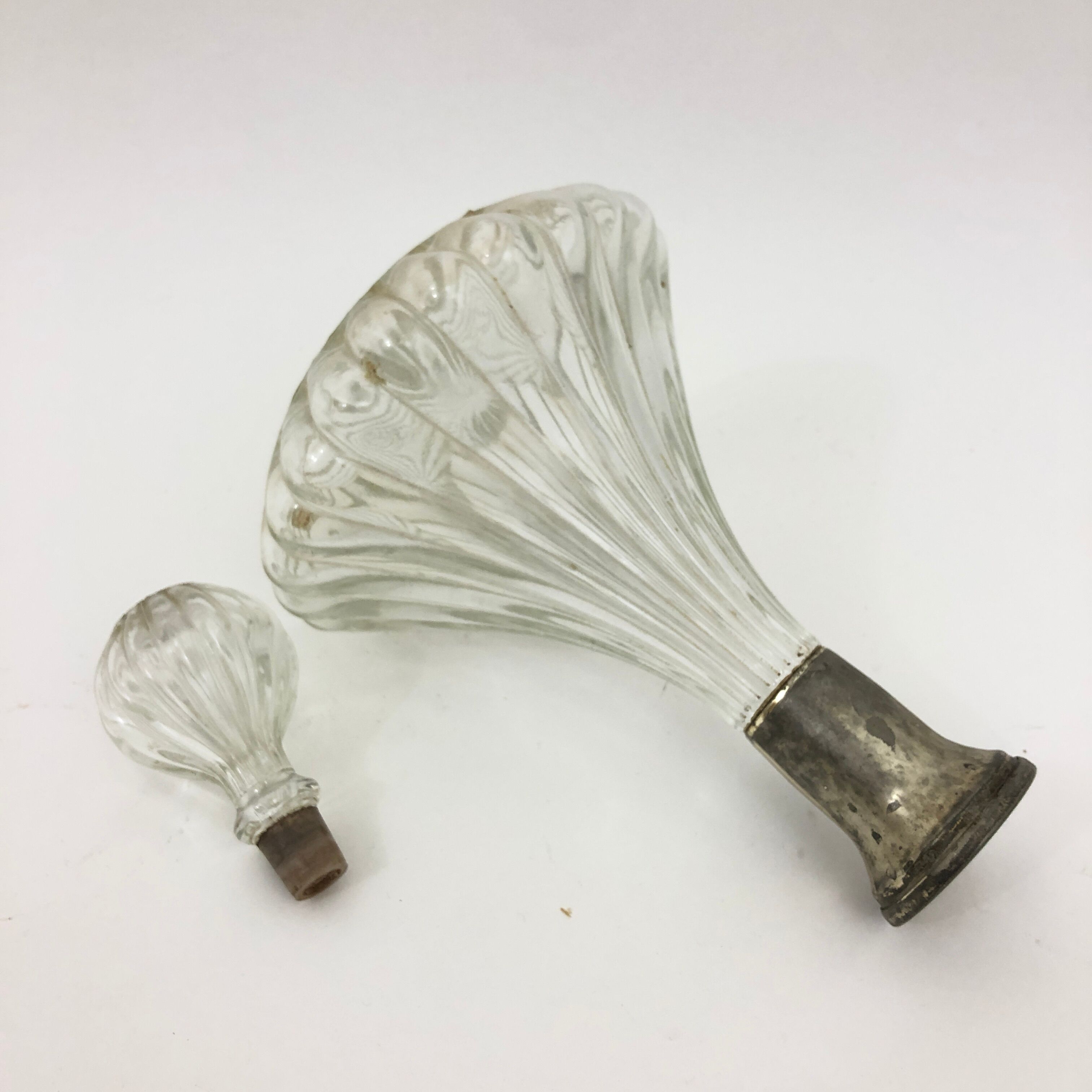 Large glass decanter and tin ring