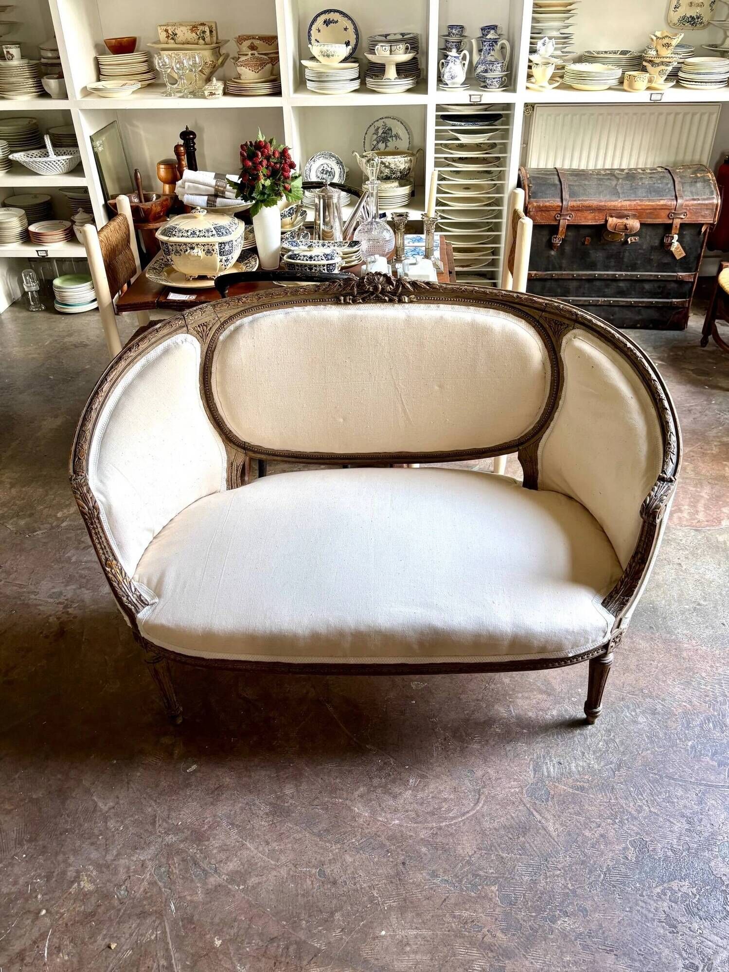 Two-seater basket bench in carved wood and beige mixed fabric, 18th century.