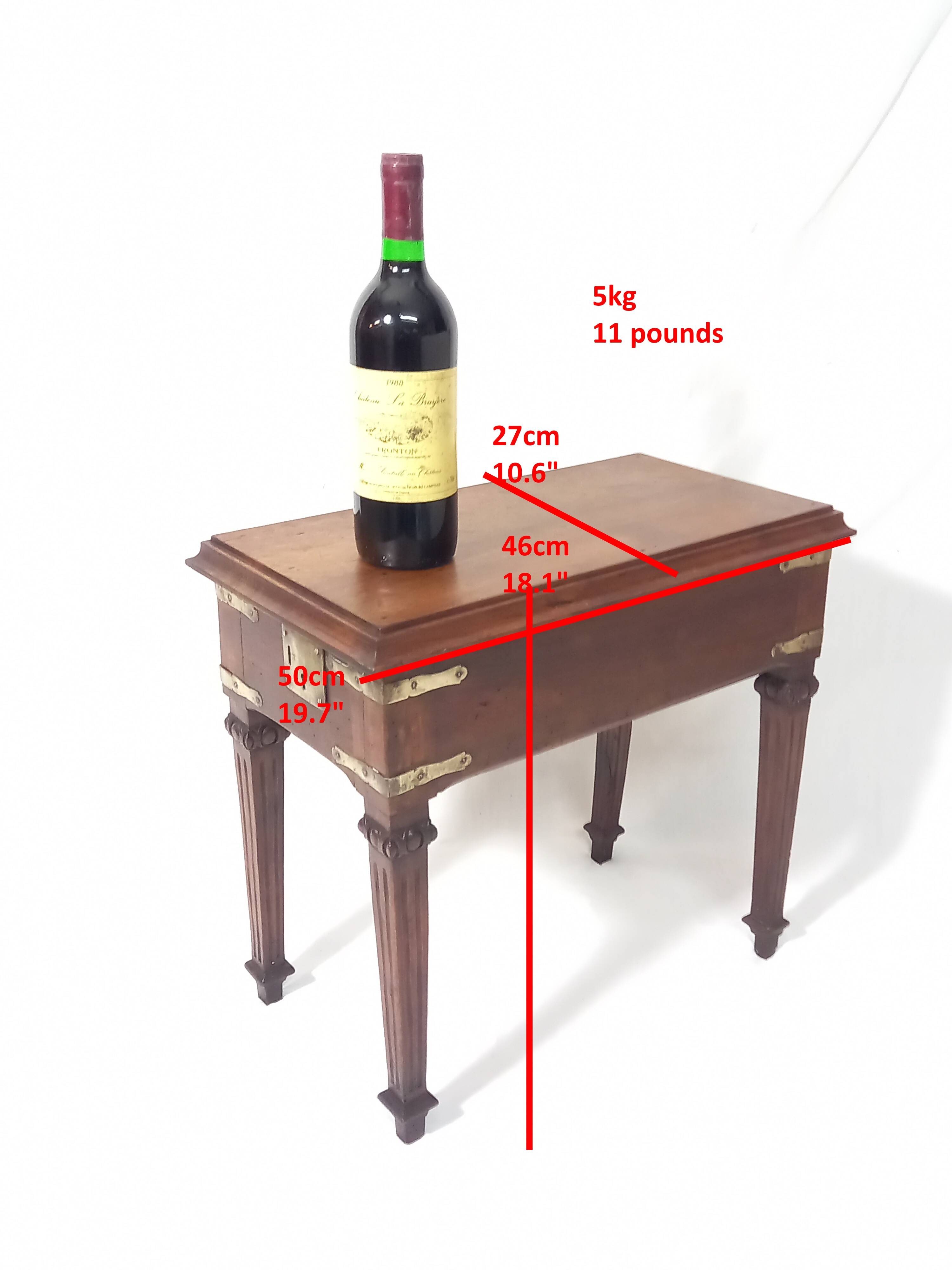 Small old side table with brass finishes