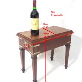 Small old side table with brass finishes