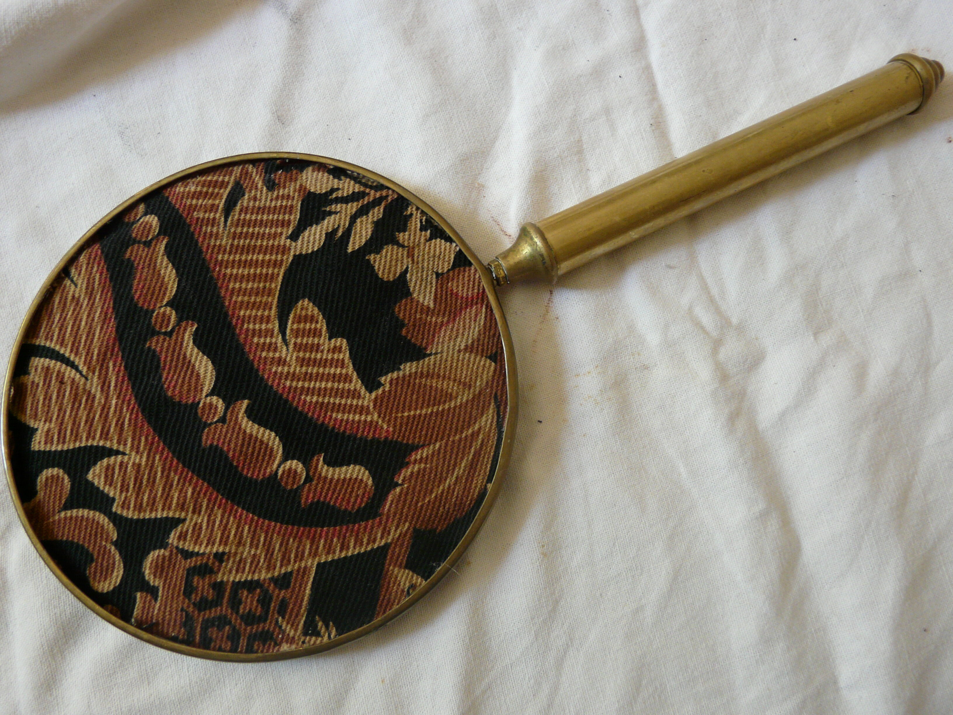 Art Deco era brass hand mirror