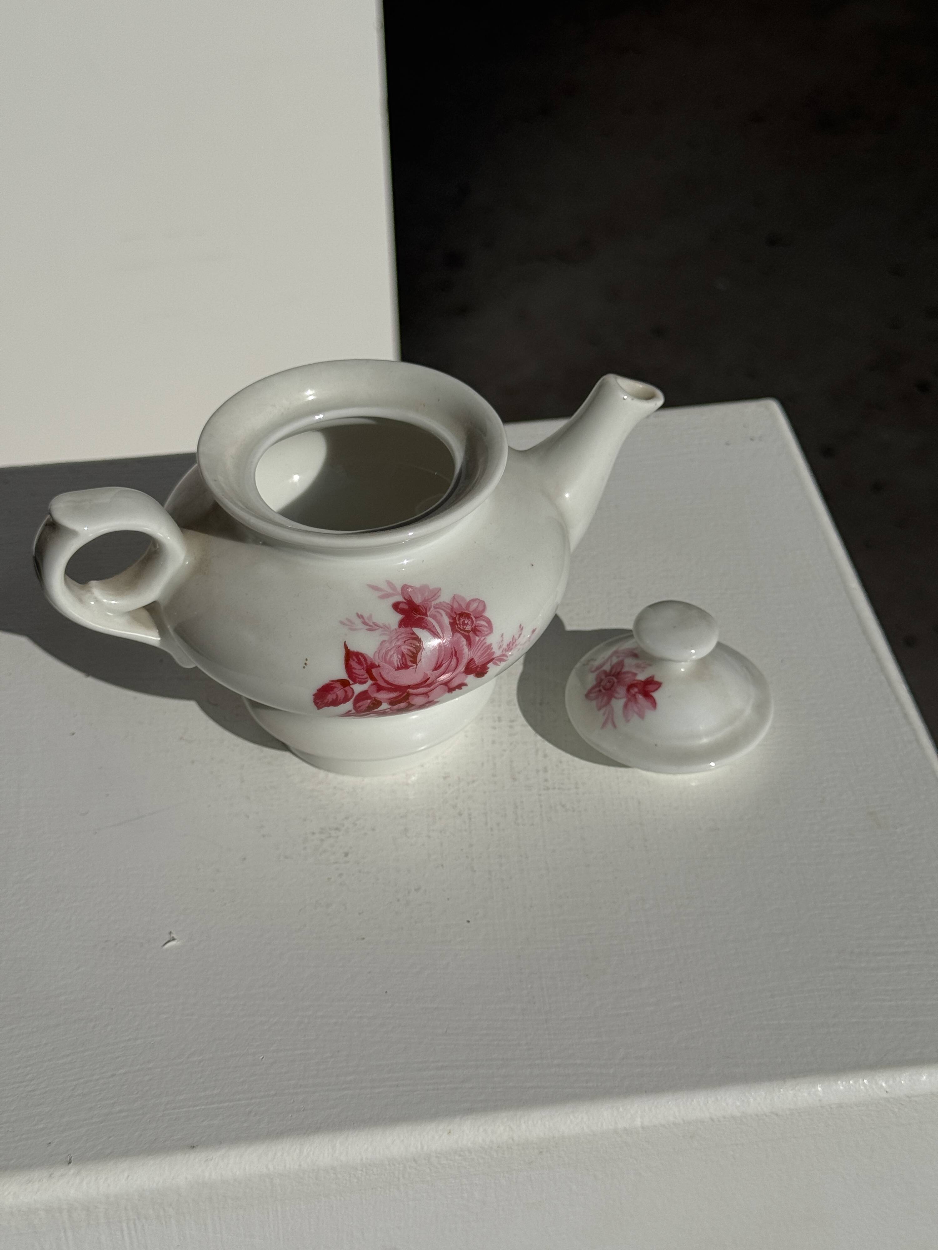 Complete porcelain teapot and warmer with pink floral decoration H18