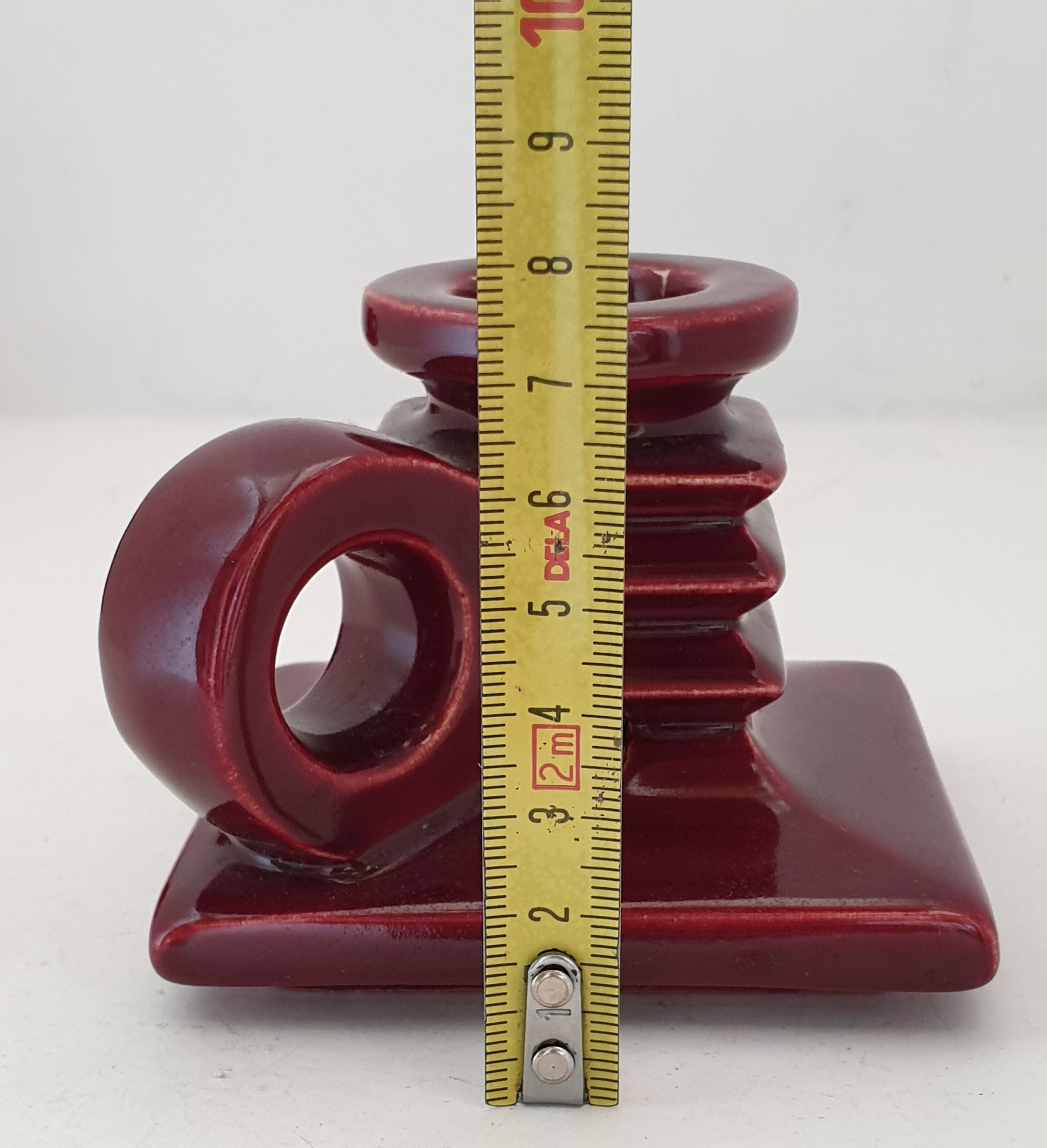 Pair of art deco candlesticks in bordeaux ceramics