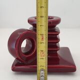 Pair of art deco candlesticks in bordeaux ceramics