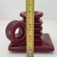 Pair of art deco candlesticks in bordeaux ceramics