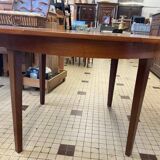 Table ronde en bois avec rallonges intégrées