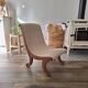 Vintage gondola armchair in beige linen fabric.
