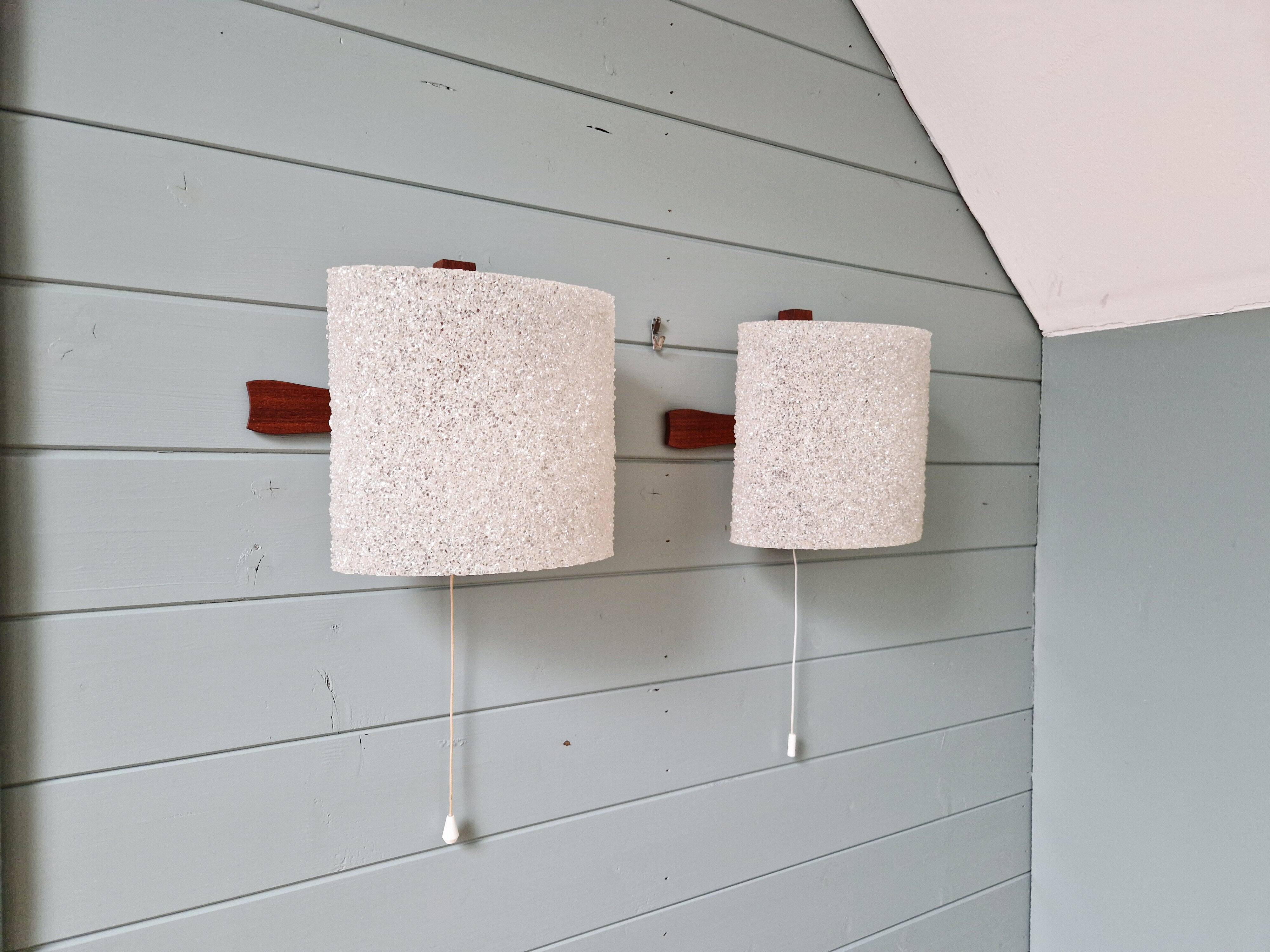 Pair of Scandinavian wall sconces in teak and plastic resin, 1960.