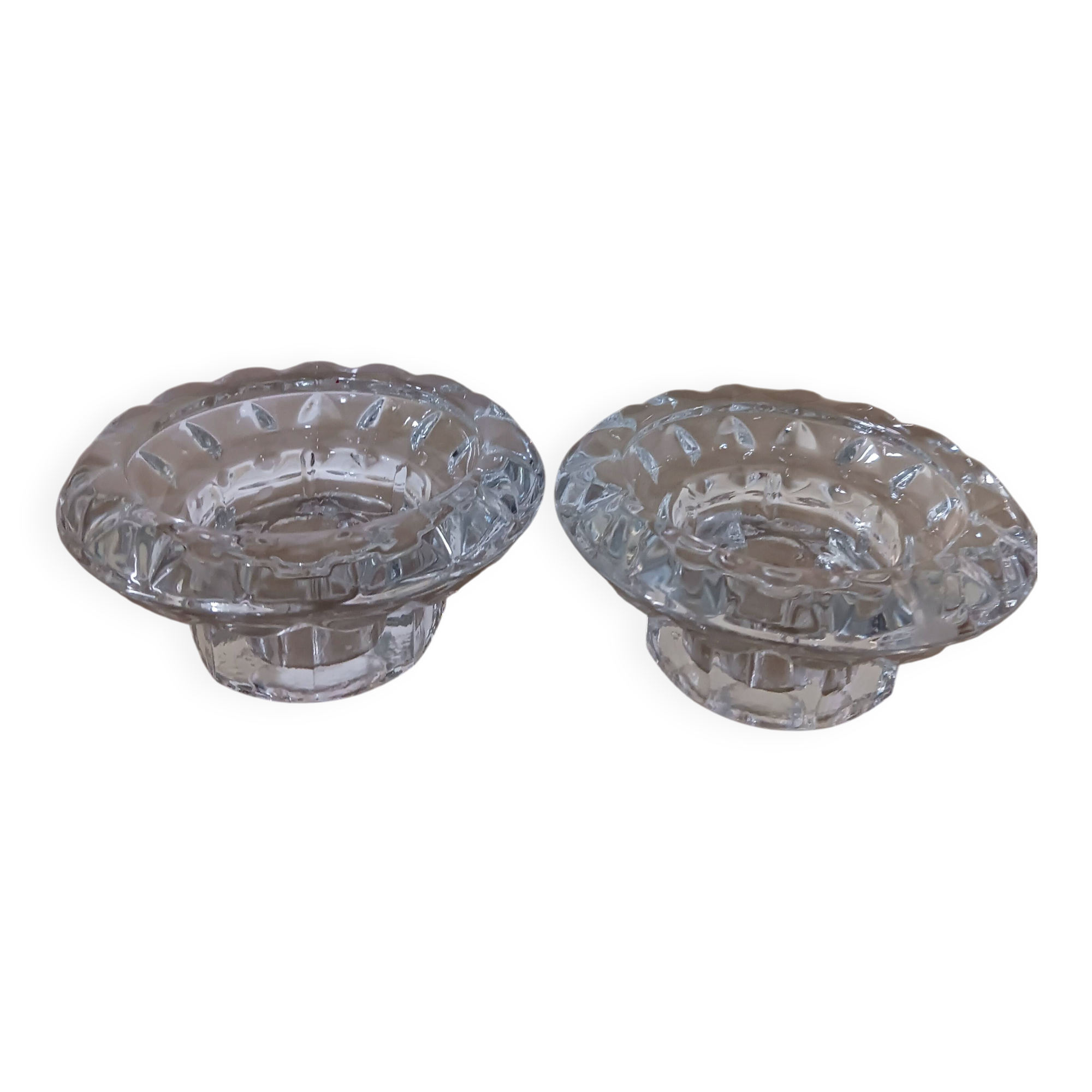 Moulded glass candle holders.
