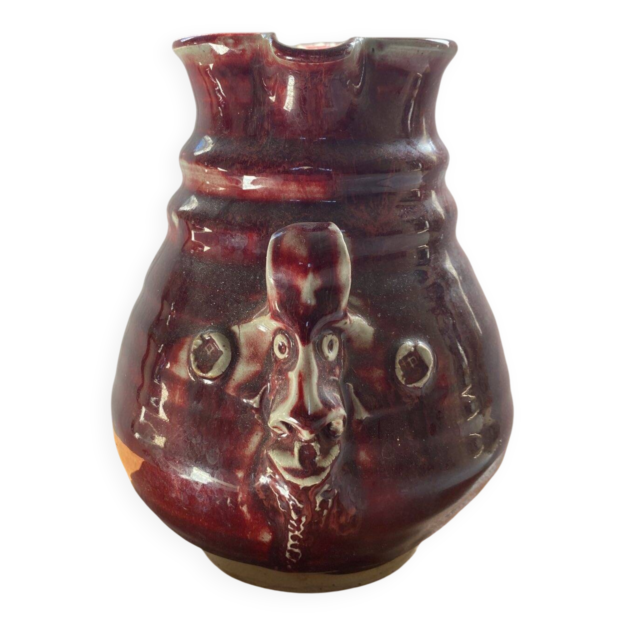 Oxblood pitcher with grotesque mask in the Delplera spirit