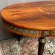 Louis XVI style oval dining table with rosewood marquetry extension mounted in bronze