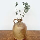 Small antique stoneware jar with handle